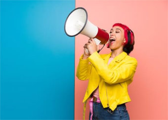 person speaking through loud horn